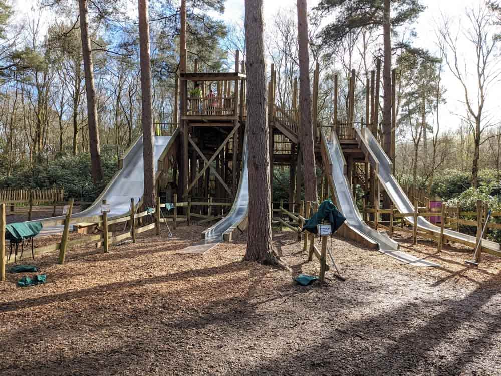 4 high slides on a wooden structure