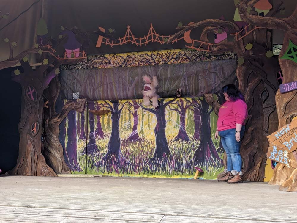 Woman on stage with a bunny puppet