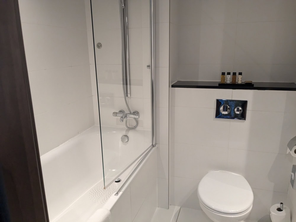 Bath with shower over it