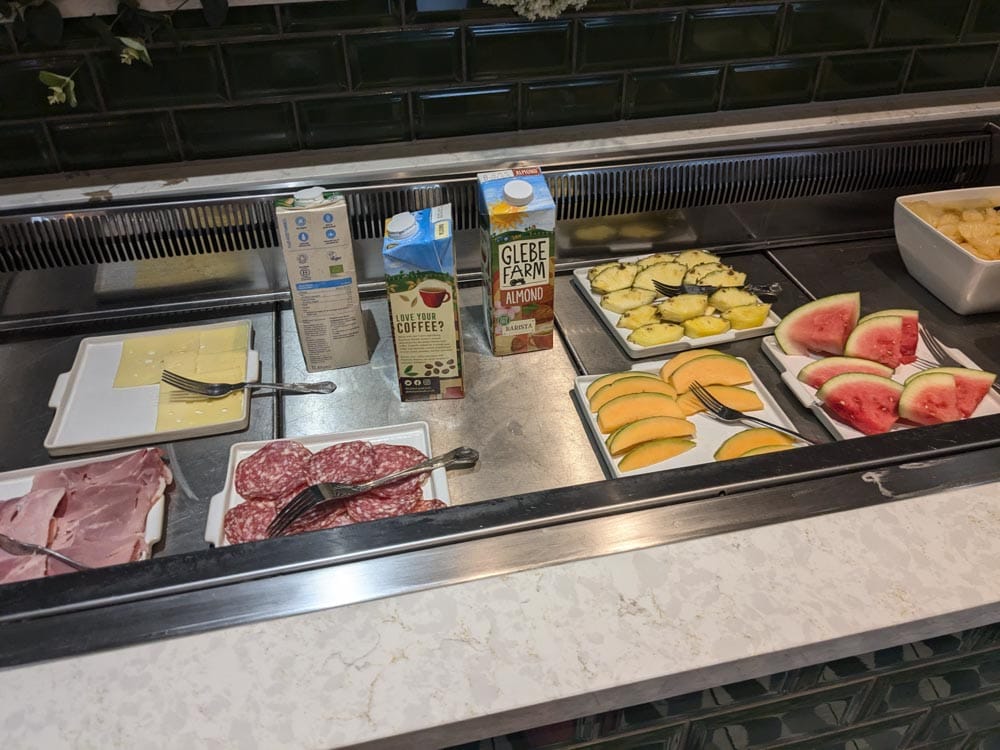 Selection of cold meats, cheese and fruit