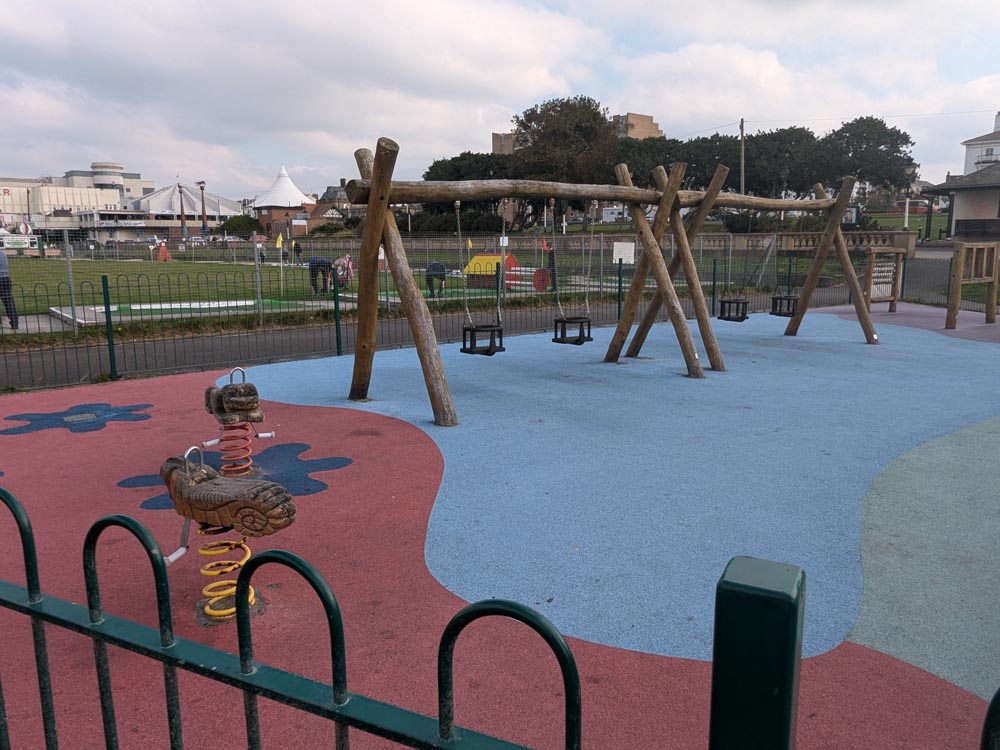 Wooden swings in a toddler play area