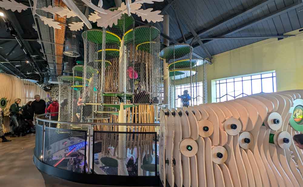 Large caged, climbing frame shaped like a tree