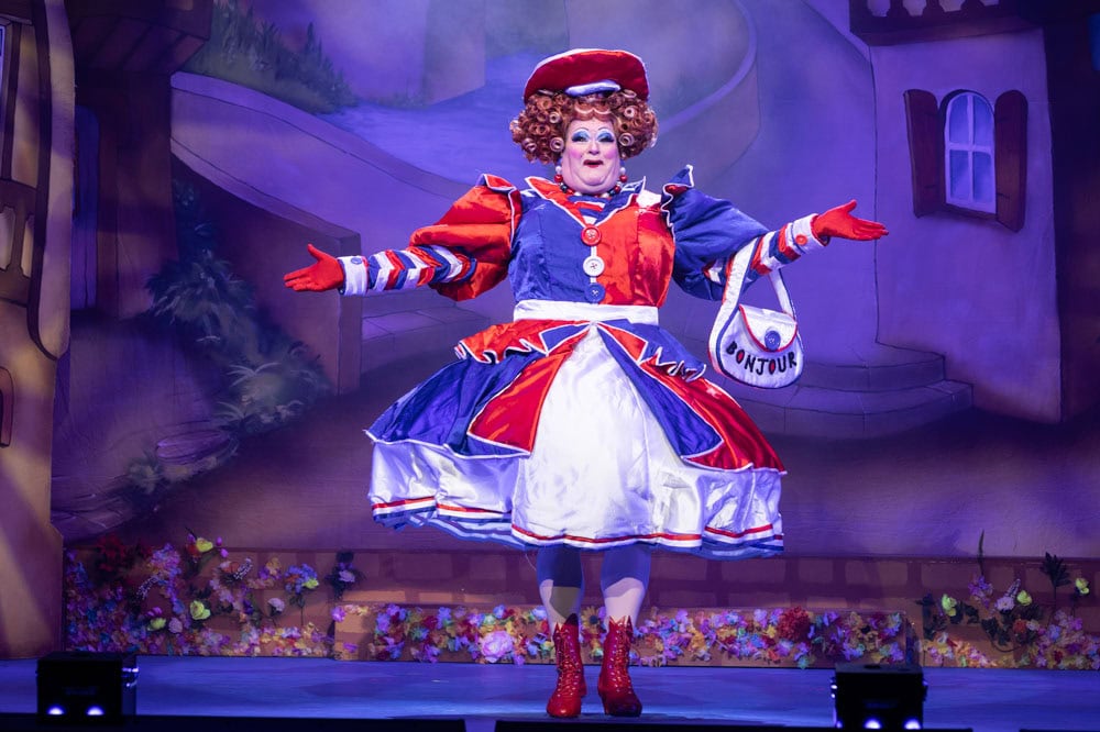 Panto dame in elaborate blue and red dress