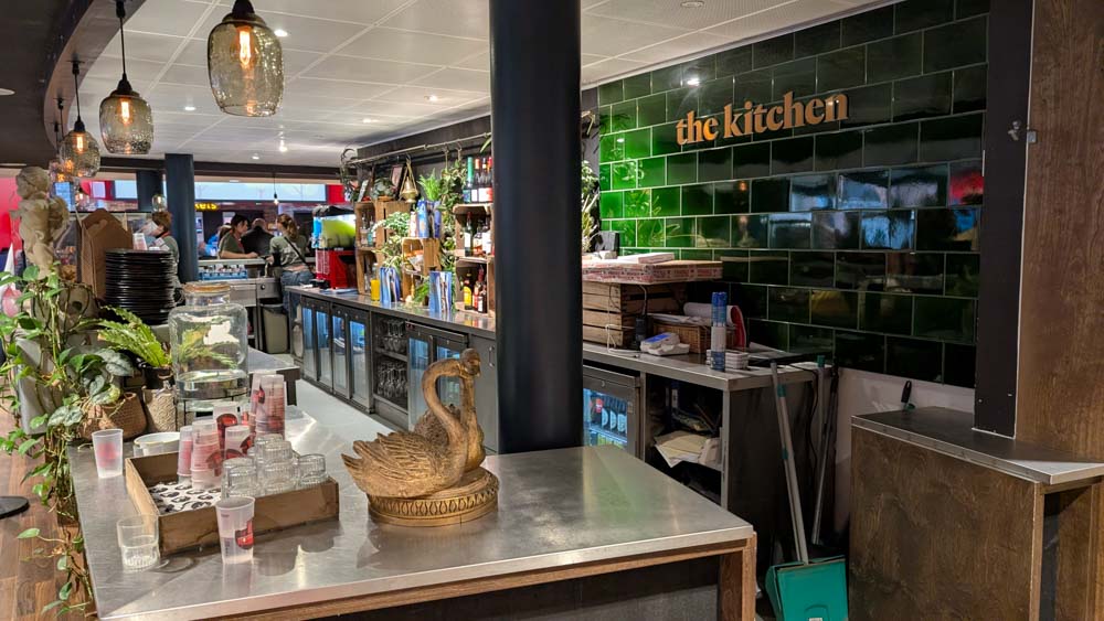 Cafe bar with dark green tiles