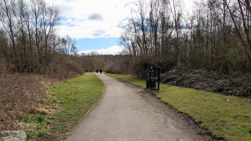 Woodlands and grassland with path through
