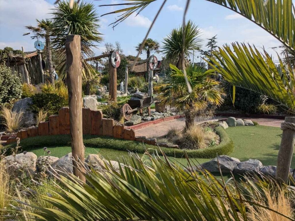 Crazy golf course with viking shields and palm trees
