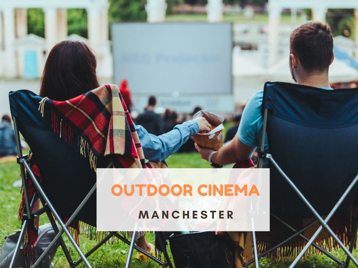 Couple sat in camping chairs, sharing crisps. They are sat looking at an outdoor cinema screen. Text reads Outdoor cinema Manchester