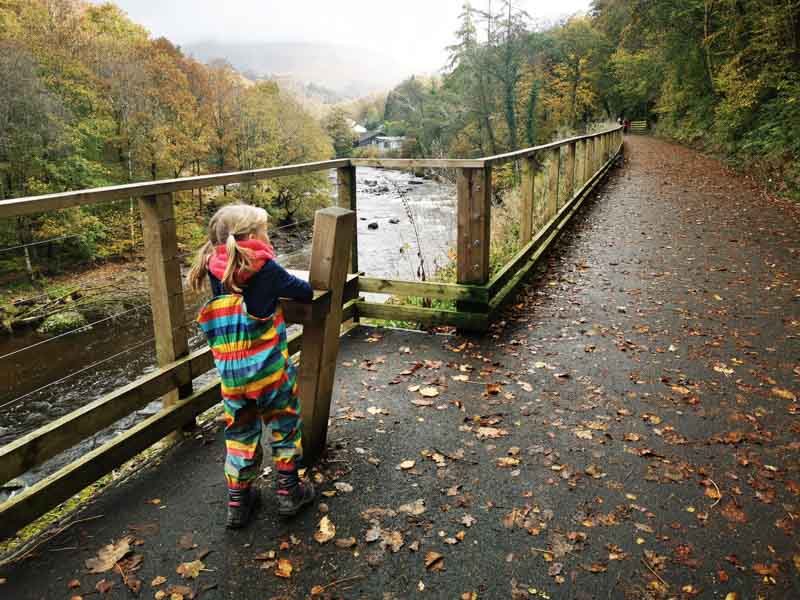 child climbing on to a high bench